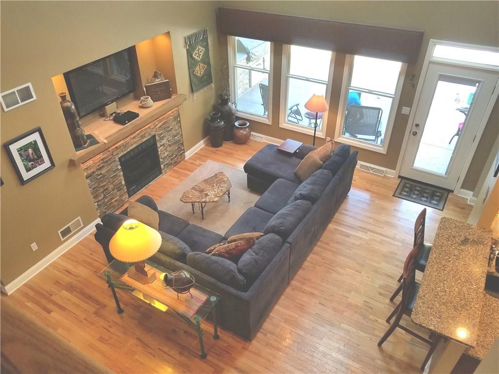 2092 Baughman Road Jeannette, PA 15644 - Photo 11 of 25 FAMILY ROOM HAS DOOR TO BEAUTIFUL IN-GROUND POOL WITH WINDOWS, HARDWOOD FLOORING.OPEN TO KITCHEN WITH VIEW OF THE LARGE LOFT AREA!