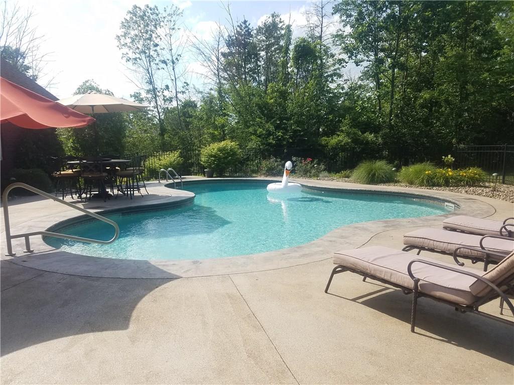2092 Baughman Road Jeannette, PA 15644 - Photo 22 of 25 RELAX BY THE CUSTOM IN-GROUND HEATED SALT WATER POOL AND ENJOY THE PRIVACY!