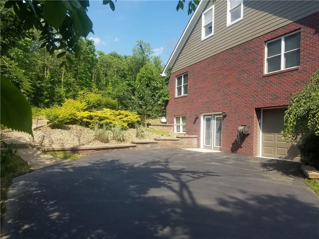 2092 Baughman Road Jeannette, PA 15644 - Photo 4 of 25 1 CAR GARAGE ON LEFT SIDE RIGHT OFF OF OFFICE AREA!
