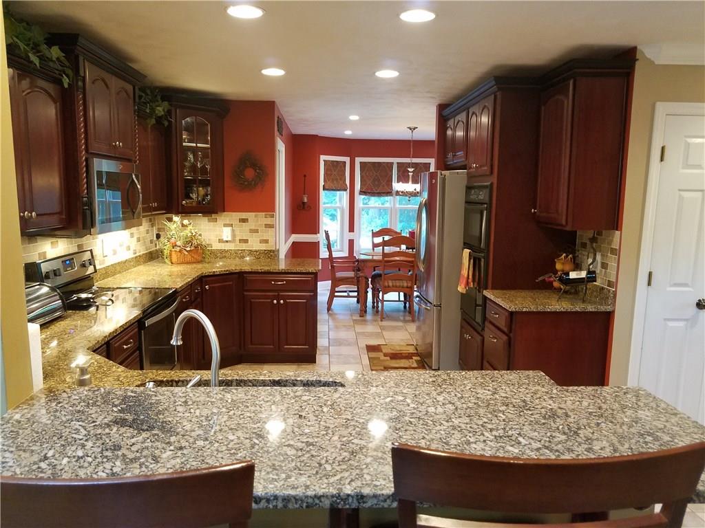 2092 Baughman Road Jeannette, PA 15644 - Photo 8 of 25 BEATUFUL KITCHEN FLOWS INTO EAT-IN AREA!