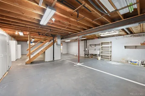 a view of empty room with wooden ceiling