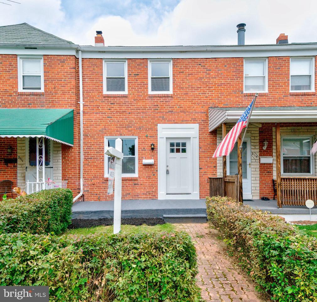 2113 Coralthorn Road Baltimore, MD 21220 - Photo 2 of 24 a front view of a house with garden