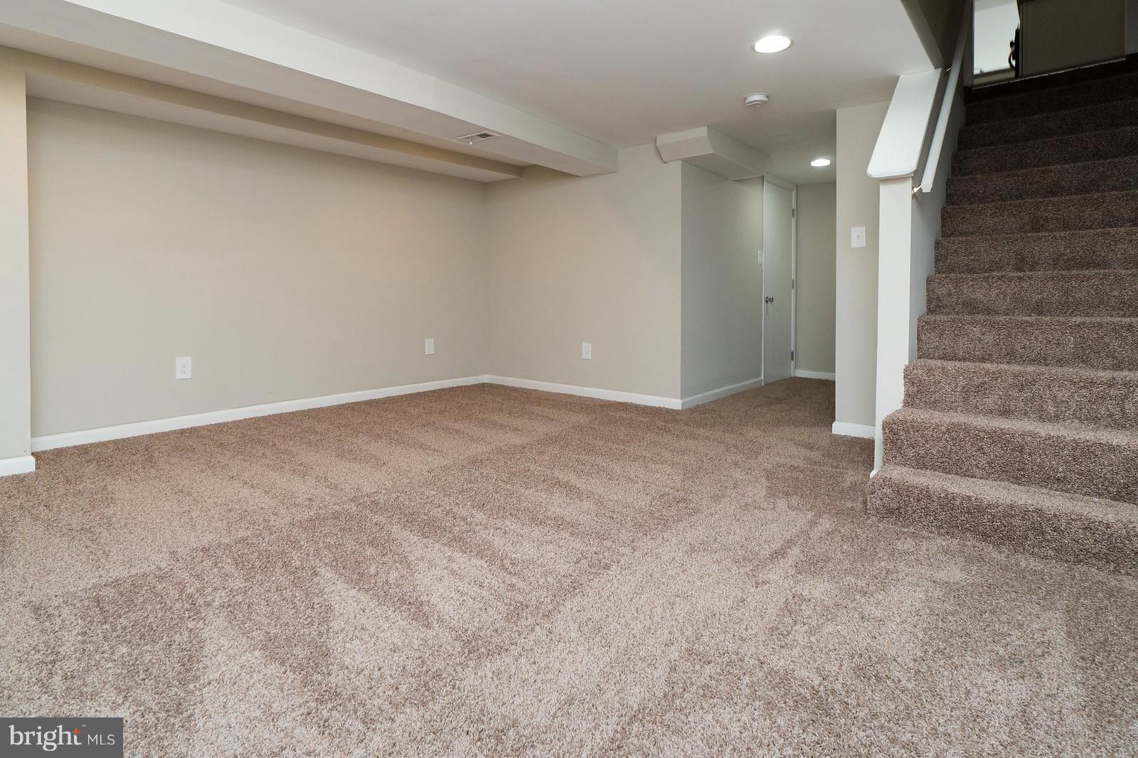 2113 Coralthorn Road Baltimore, MD 21220 - Photo 14 of 24 a view of an empty room with stairs
