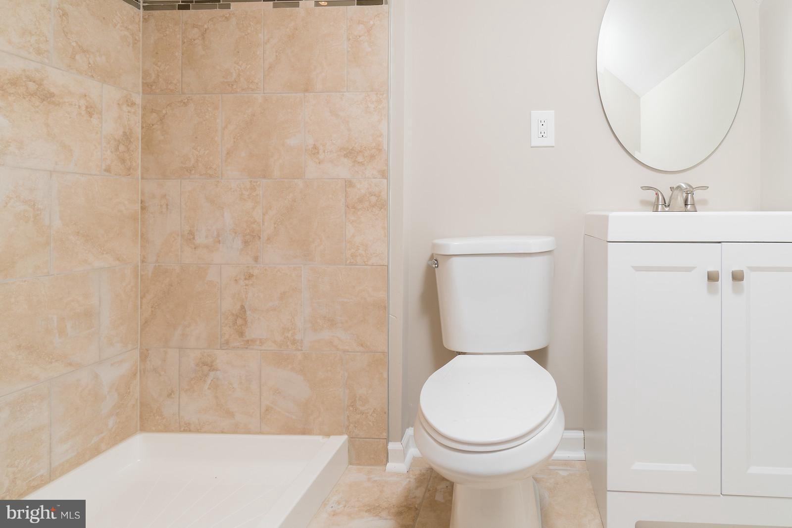 2113 Coralthorn Road Baltimore, MD 21220 - Photo 17 of 24 a white toilet sitting next to a bathroom sink