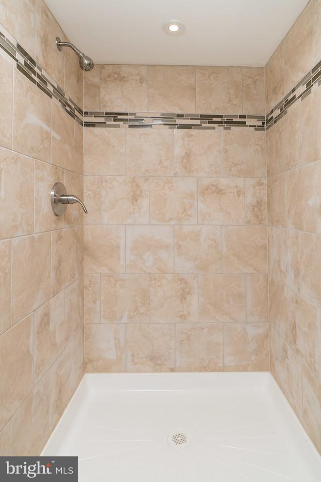 2113 Coralthorn Road Baltimore, MD 21220 - Photo 18 of 24 a bathroom with a shower and a glass door