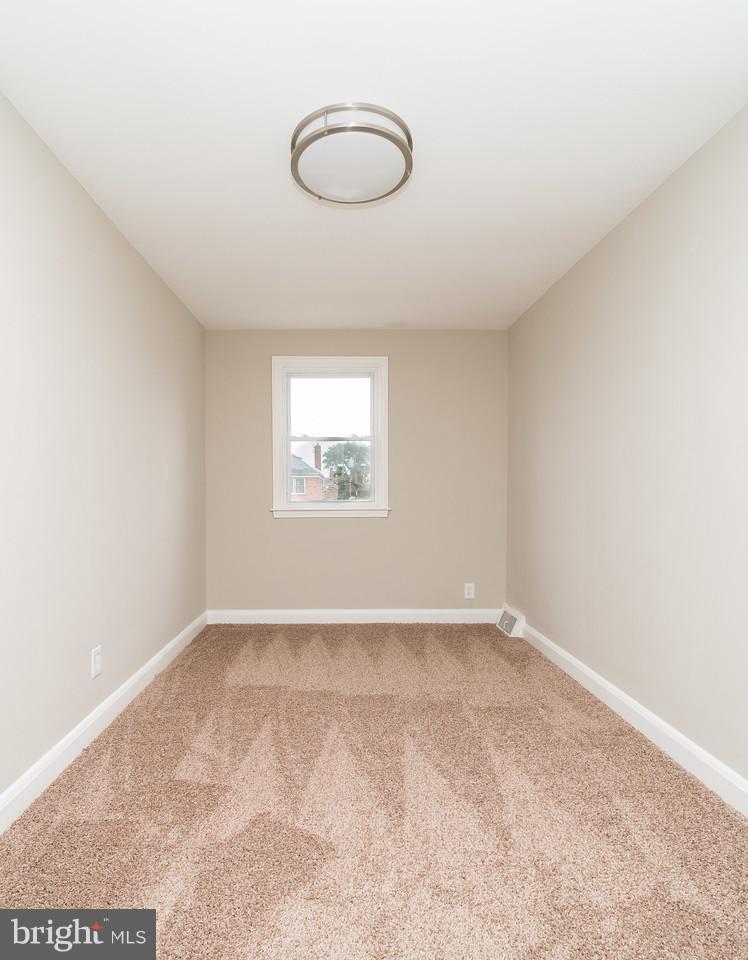 2113 Coralthorn Road Baltimore, MD 21220 - Photo 23 of 24 an empty room with a empty space and windows