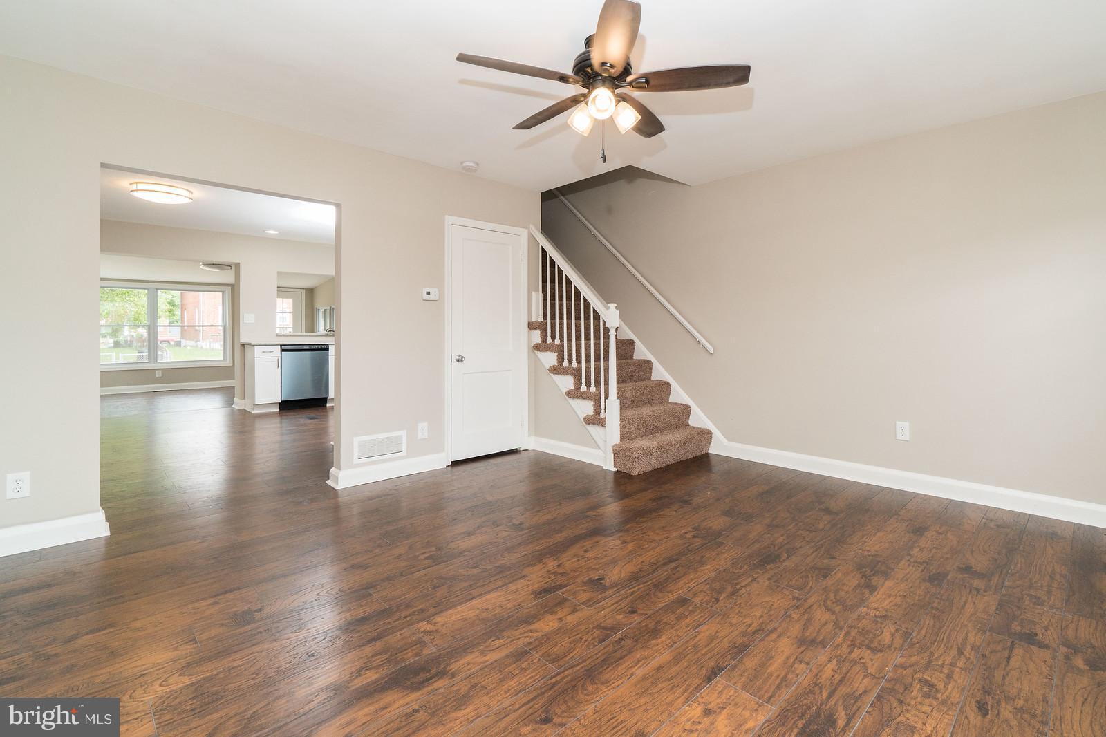 2113 Coralthorn Road Baltimore, MD 21220 - Photo 5 of 24 wooden floor in an empty room with a window