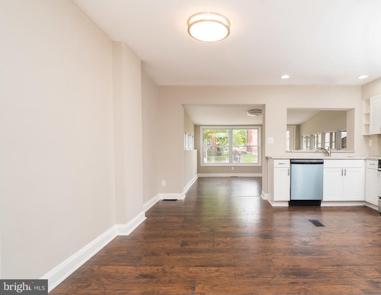2113 Coralthorn Road Baltimore, MD 21220 - Photo 7 of 24 a view of a kitchen with wooden floor and a window