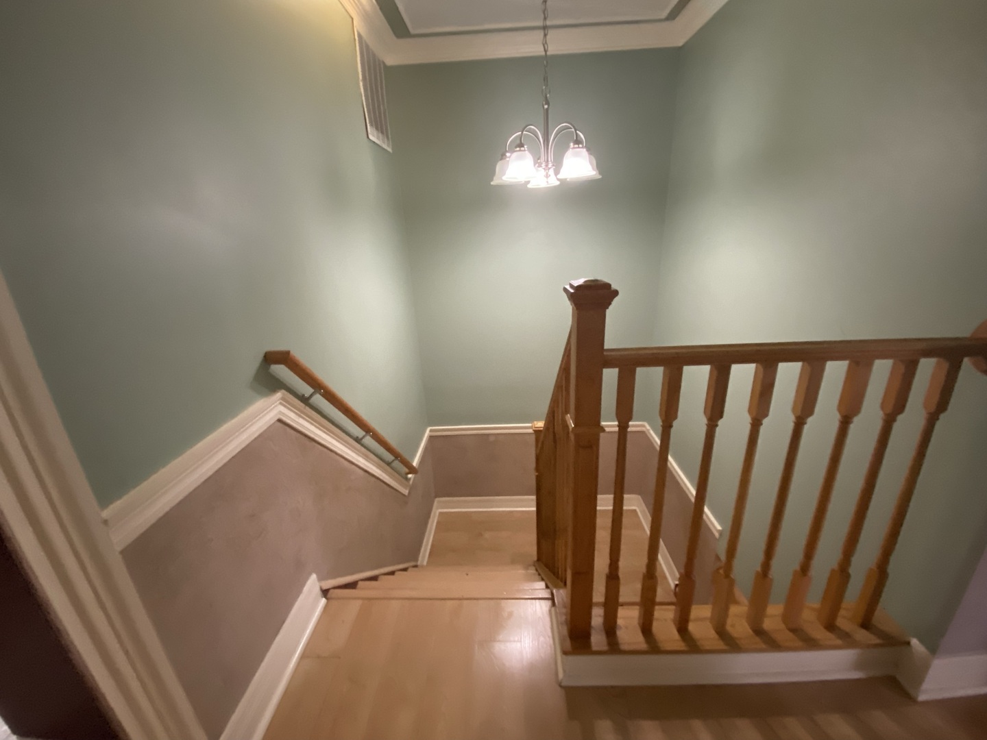 529 Julie Road Bolingbrook, IL 60440 - Photo 4 of 12 a view of staircase with railing and a chandelier