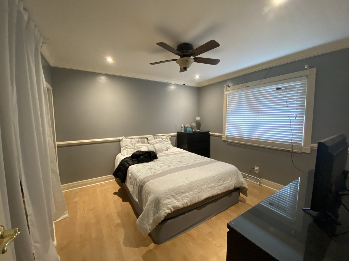 529 Julie Road Bolingbrook, IL 60440 - Photo 5 of 12 a bedroom with a bed and a flat screen tv