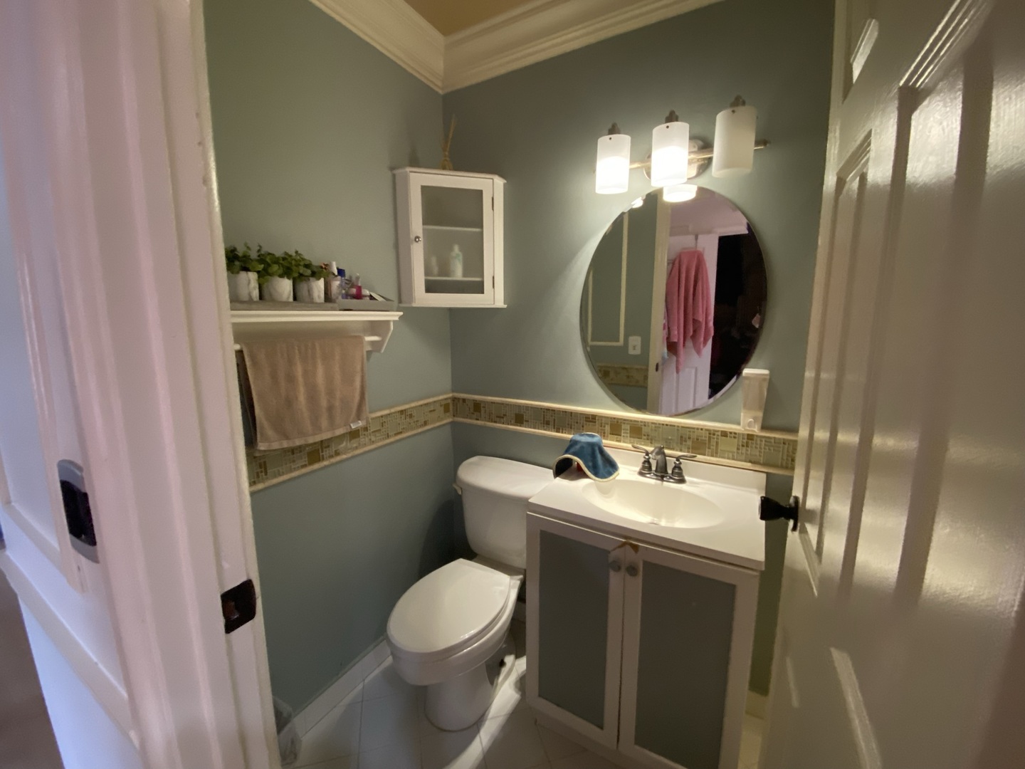 529 Julie Road Bolingbrook, IL 60440 - Photo 7 of 12 a bathroom with a toilet sink and mirror