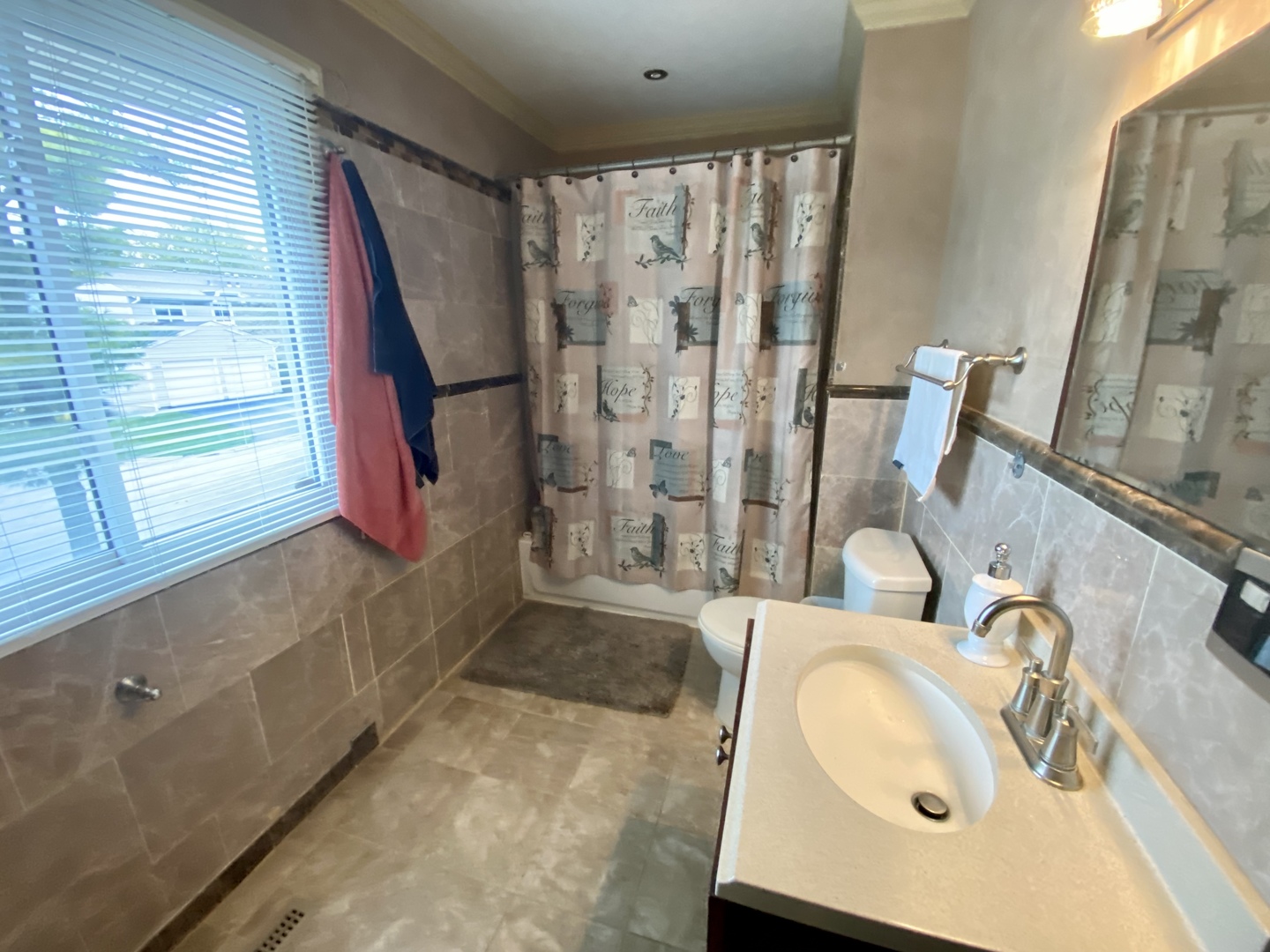 529 Julie Road Bolingbrook, IL 60440 - Photo 9 of 12 a bathroom with a sink and a mirror