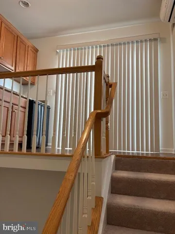 a bath tub sitting in a bathroom next to a window