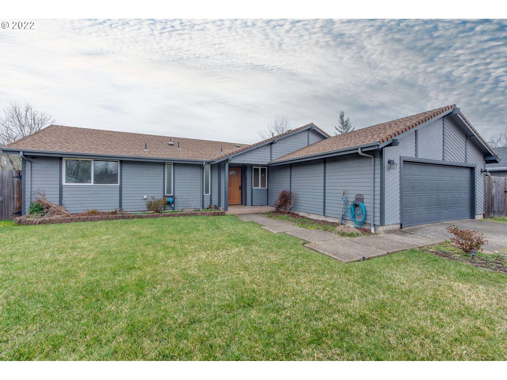 252 71st Street Springfield, OR 97478 - Photo 1 of 30 a view of a house with a yard and sitting area