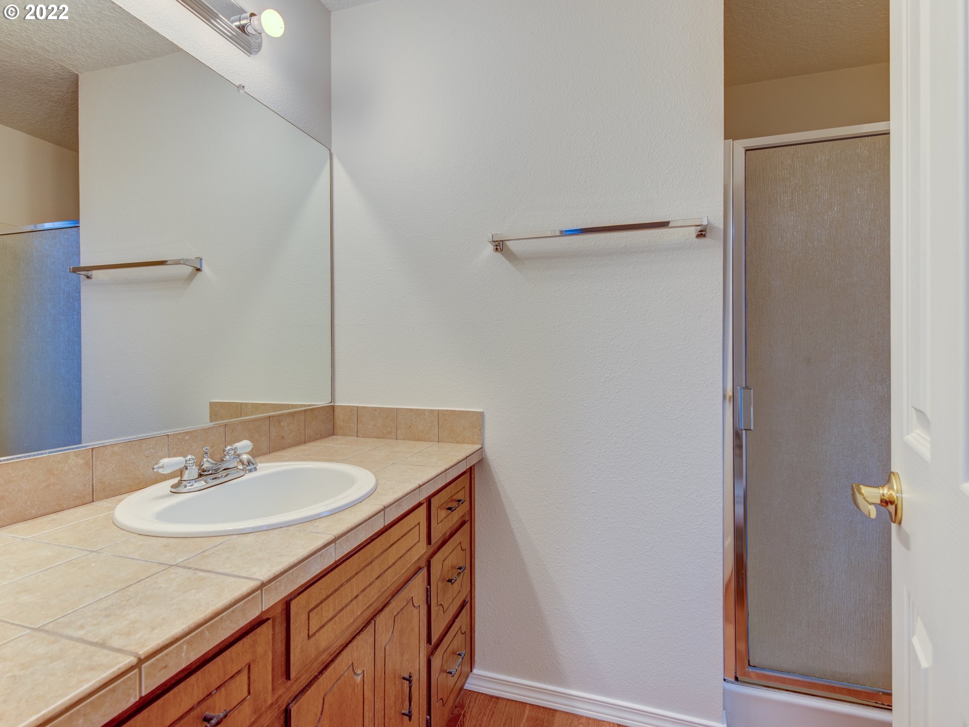 252 71st Street Springfield, OR 97478 - Photo 21 of 30 a bathroom with a sink and a mirror
