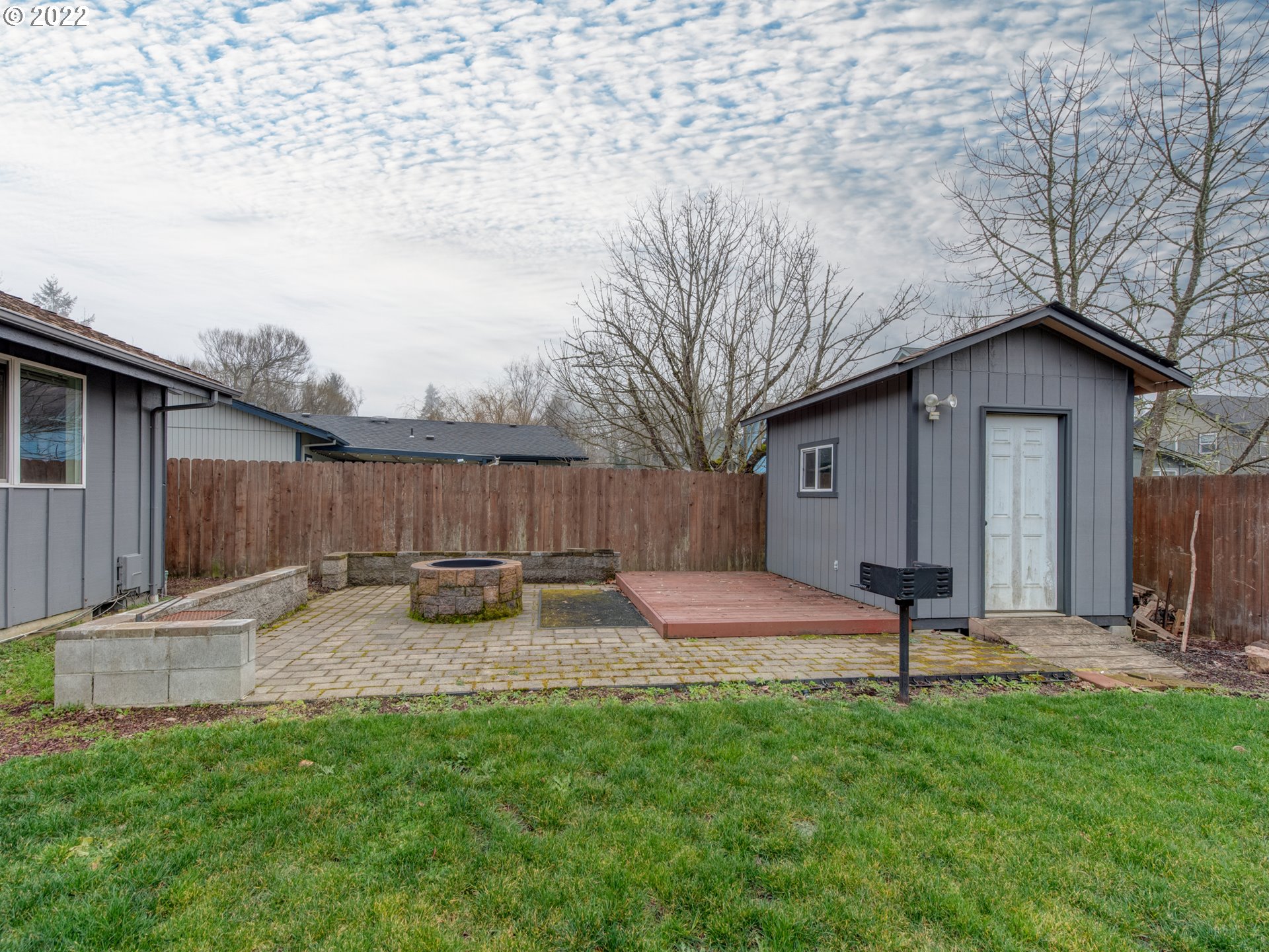 252 71st Street Springfield, OR 97478 - Photo 27 of 30 a backyard of a house with table and chairs
