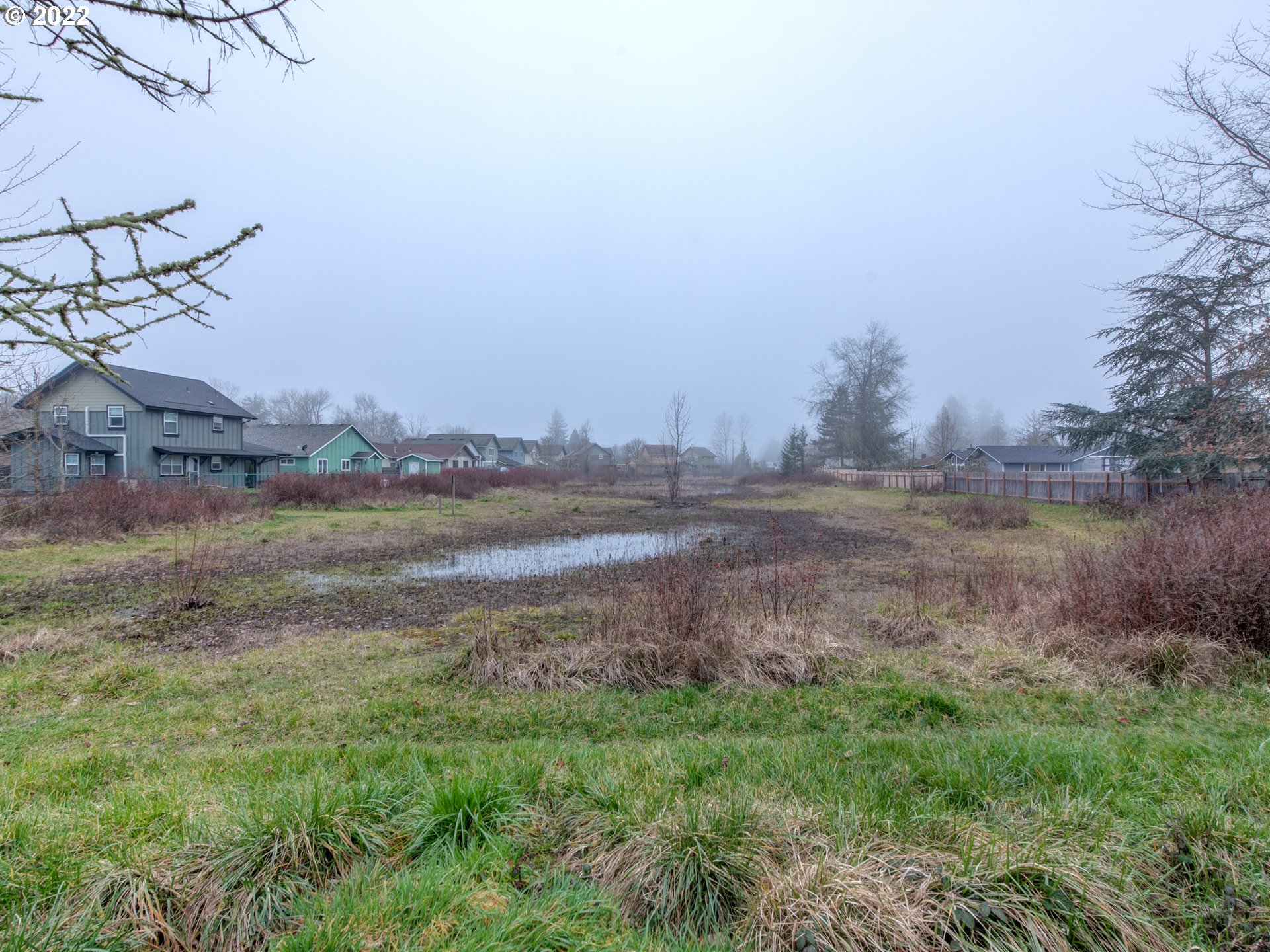 252 71st Street Springfield, OR 97478 - Photo 29 of 30 a view of a lake with a big yard
