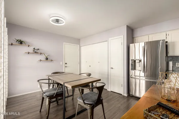 a view of a dining room with furniture and wooden floor