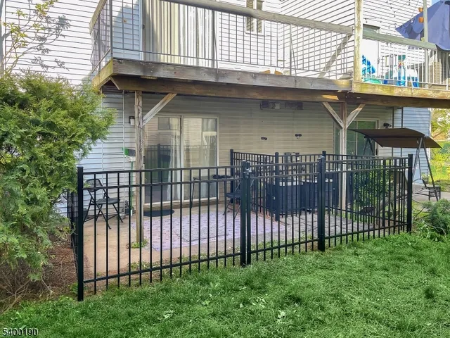 a view of a wrought iron fences in front of house