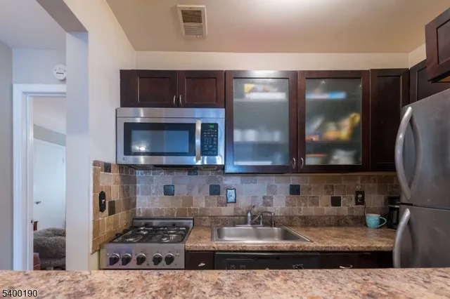 a kitchen with a stove and a microwave