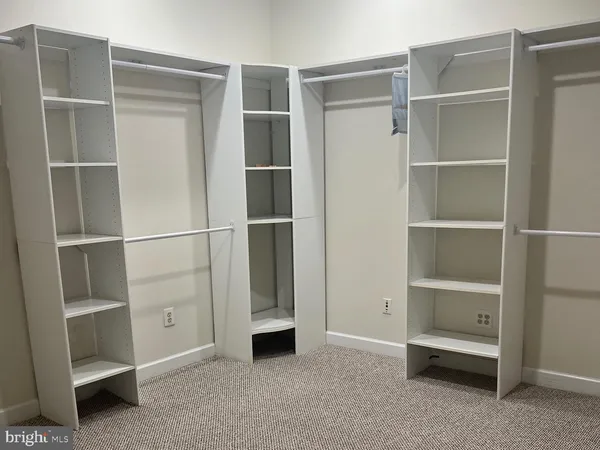 a view of an empty walk in closet
