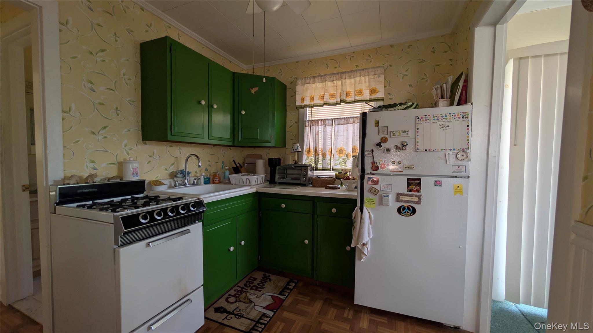 191 Sylvan Lake Road, Unit 5 Hopewell Junction, NY 12533 - Photo 11 of 28 a kitchen with a refrigerator sink and cabinets