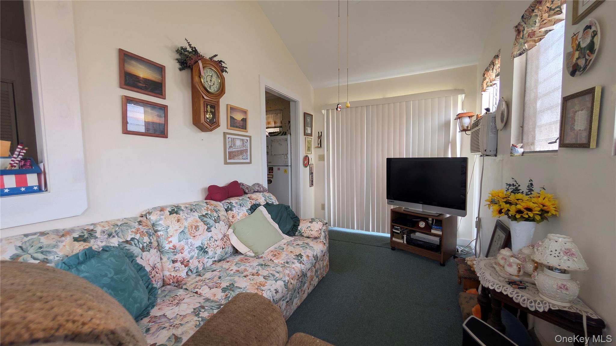 191 Sylvan Lake Road, Unit 5 Hopewell Junction, NY 12533 - Photo 13 of 28 a living room with furniture and a flat screen tv