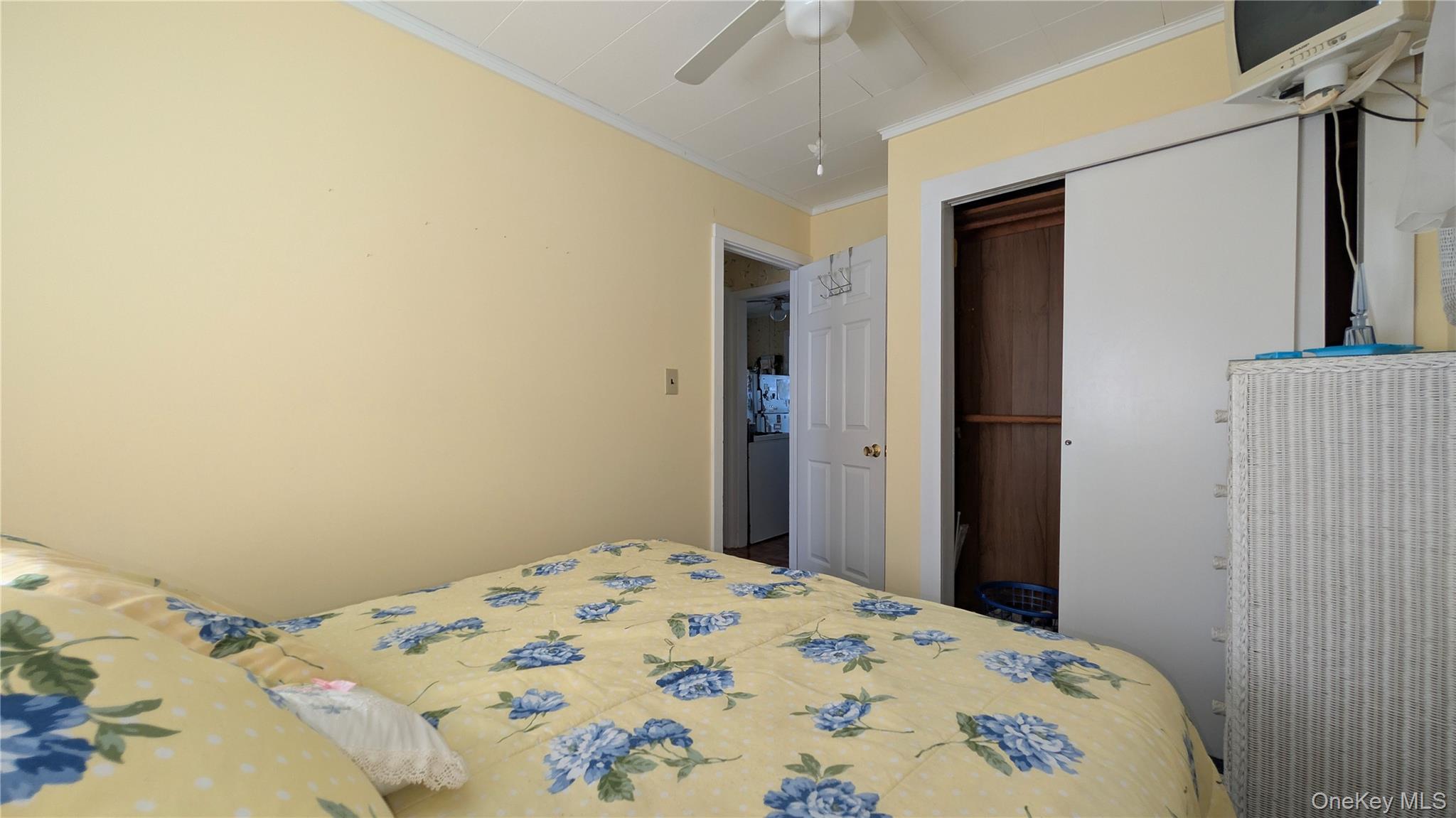 191 Sylvan Lake Road, Unit 5 Hopewell Junction, NY 12533 - Photo 16 of 28 a bedroom with a bed and a chandelier