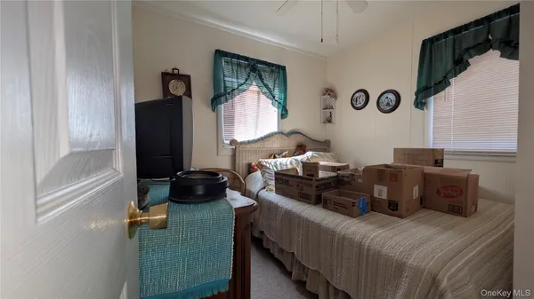 a living room with furniture and a mirror