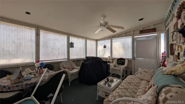 a bedroom with furniture and a window