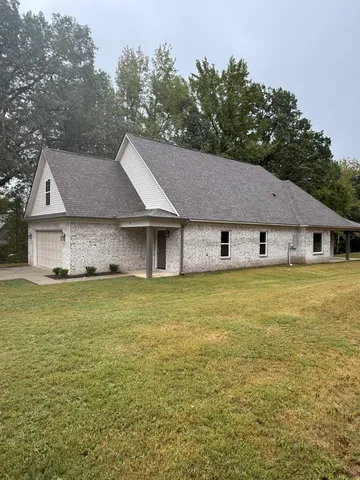 a house view with a garden space