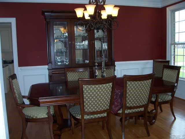 1529 Brick Mill Road Coats, NC 27521 - Photo 3 of 12 Beautiful dining room with crown molding and wainscoating