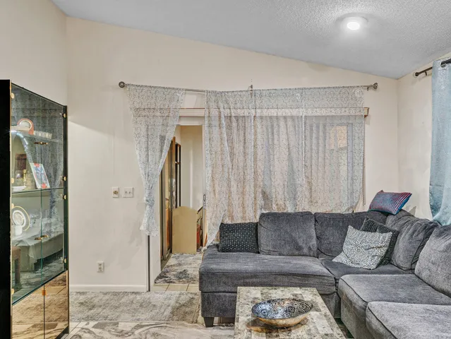 a bedroom with a bed and a table