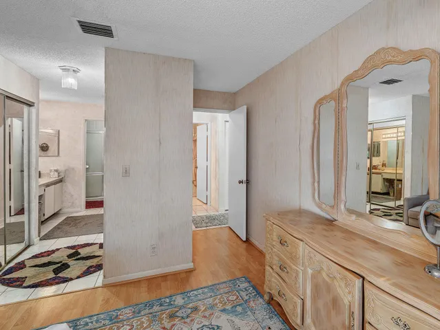 a view of a hallway to a livingroom and a livingroom