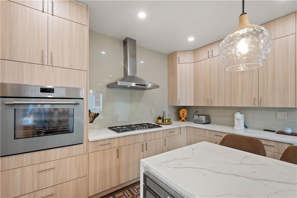 1520 4th Avenue Coraopolis, PA 15108 - Photo 12 of 37 a kitchen with a sink a stove and cabinets