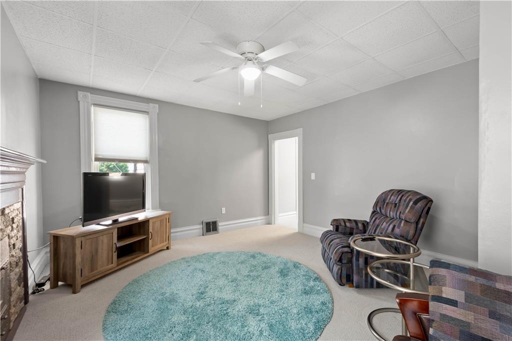 1520 4th Avenue Coraopolis, PA 15108 - Photo 22 of 37 a living room with furniture and a flat screen tv