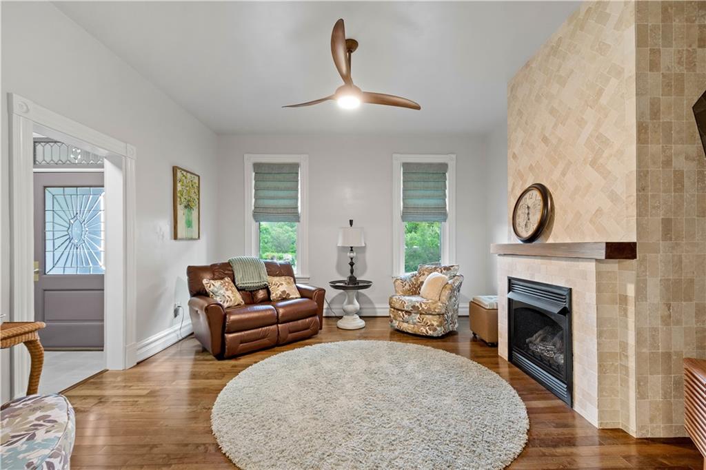 1520 4th Avenue Coraopolis, PA 15108 - Photo 6 of 37 a living room with furniture a fireplace and a table