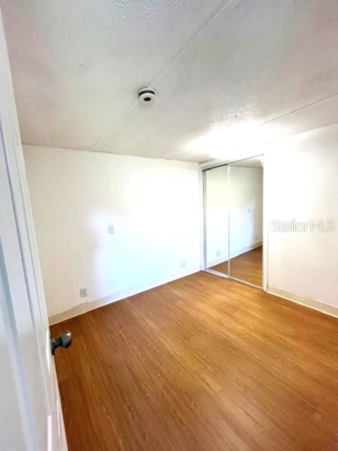 207 Ketch Road St. Cloud, FL 34771 - Photo 12 of 18 an empty room with wooden floor