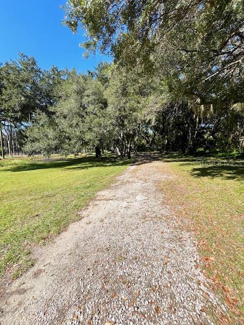 207 Ketch Road St. Cloud, FL 34771 - Photo 15 of 18 a view of a swimming pool and an outdoor space