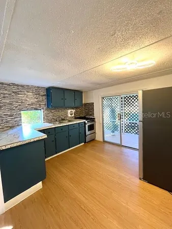 a view of a kitchen with a sink