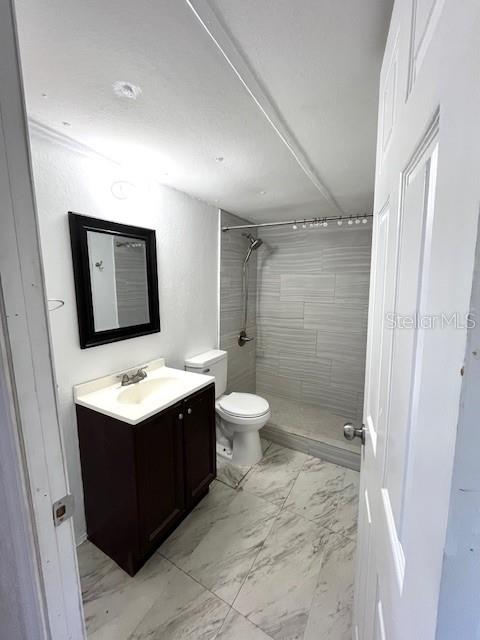 207 Ketch Road St. Cloud, FL 34771 - Photo 3 of 18 a bathroom with a sink toilet and shower