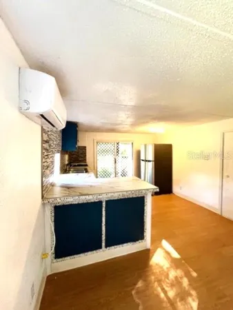 a kitchen with stainless steel appliances granite countertop a sink and a stove