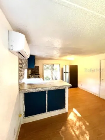 a kitchen with stainless steel appliances granite countertop a sink and a stove
