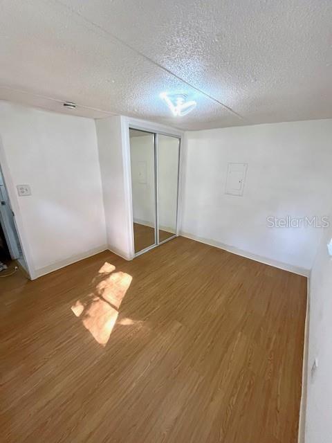 207 Ketch Road St. Cloud, FL 34771 - Photo 10 of 18 an empty room with wooden floor and natural light