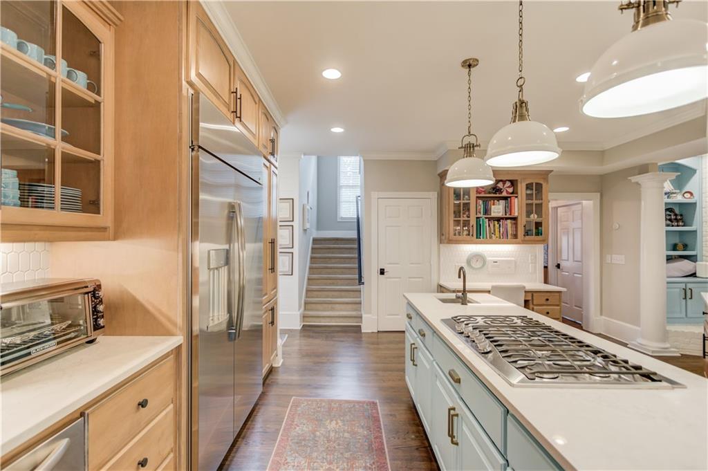 1345 Chandler Road Lawrenceville, GA 30045 - Photo 24 of 97 a kitchen with stainless steel appliances granite countertop a sink stove and refrigerator