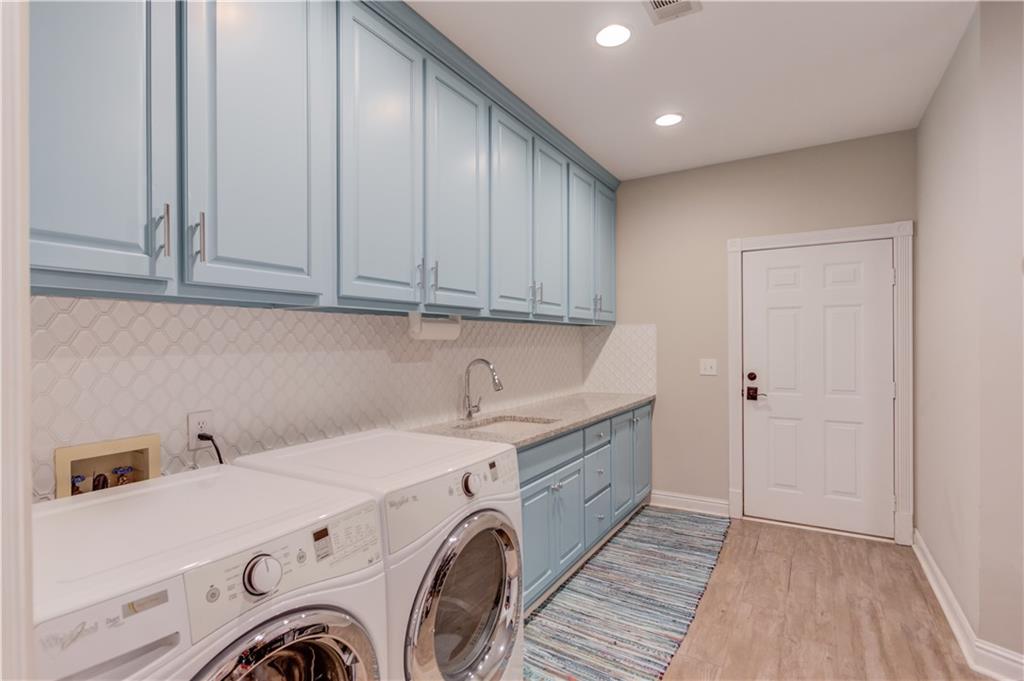 1345 Chandler Road Lawrenceville, GA 30045 - Photo 27 of 97 a view of storage and utility room with washer and dryer
