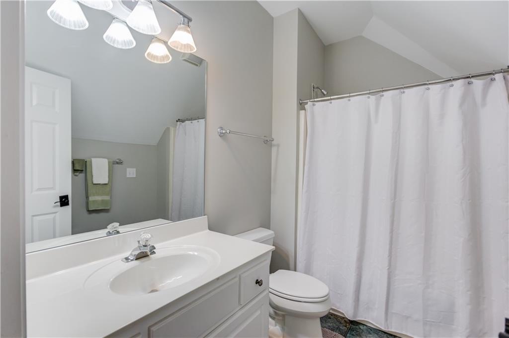 1345 Chandler Road Lawrenceville, GA 30045 - Photo 44 of 97 a bathroom with a sink vanity mirror and toilet
