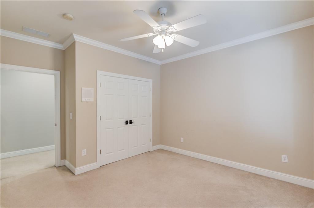 1345 Chandler Road Lawrenceville, GA 30045 - Photo 48 of 97 a view of an empty room with a ceiling fan