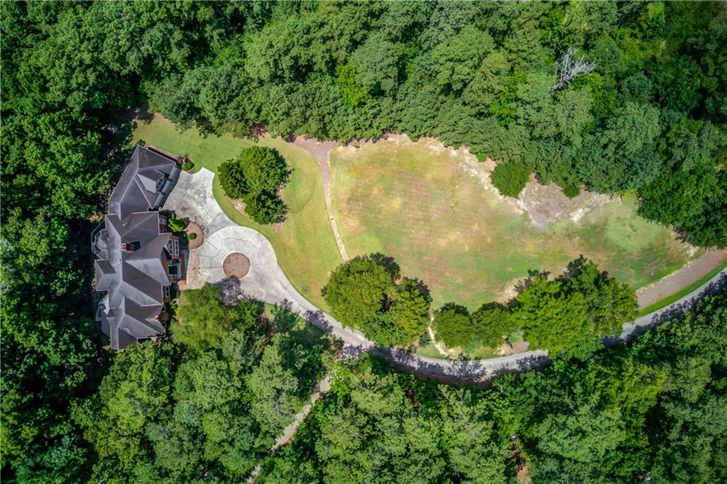 1345 Chandler Road Lawrenceville, GA 30045 - Photo 5 of 97 an aerial view of a residential houses with outdoor space and trees all around
