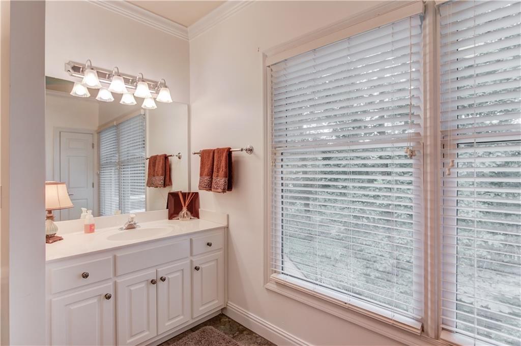 1345 Chandler Road Lawrenceville, GA 30045 - Photo 53 of 97 a bathroom with a double vanity sink and a mirror